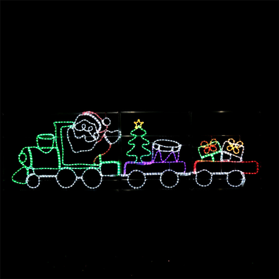 LED Christmas train with Santa, a Christmas tree and gifts lit up at night